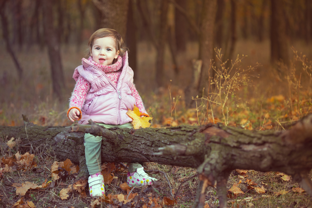 dad with daughter on picnic in the autumn forest