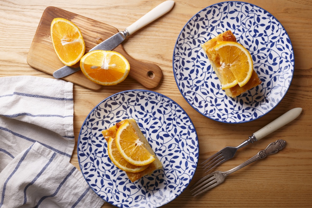 traditional greek orange pie on beautiful plates - Portokalopita