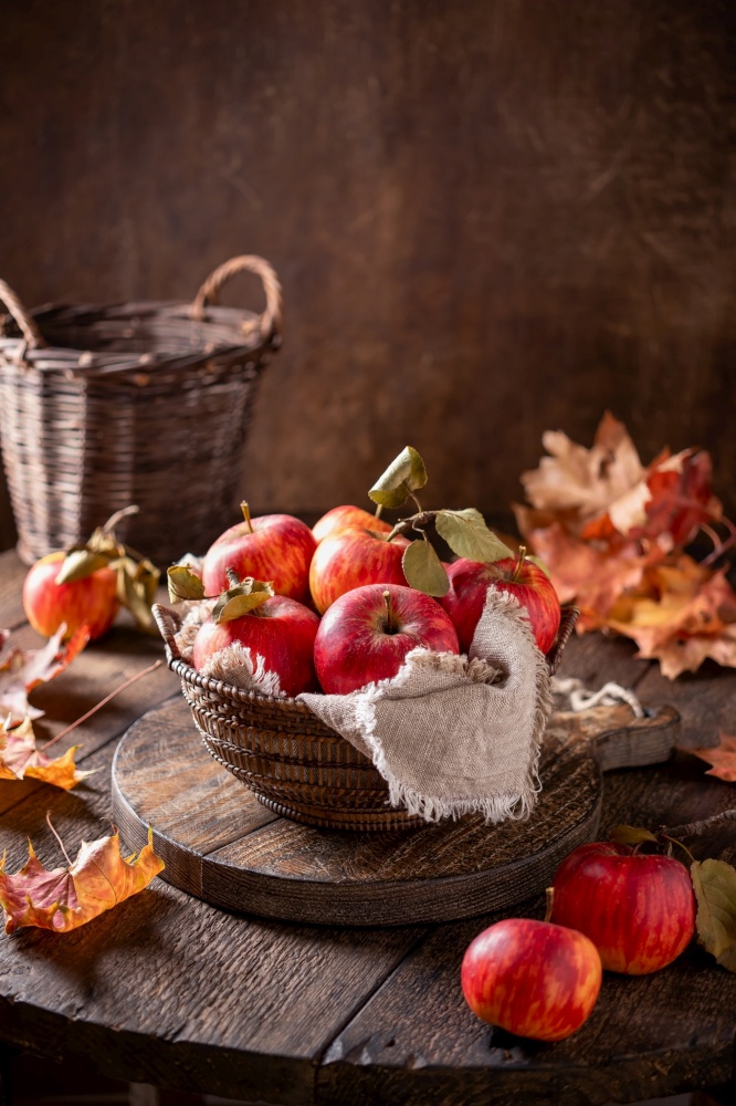 Fresh ripe apples in a basket, with copy space