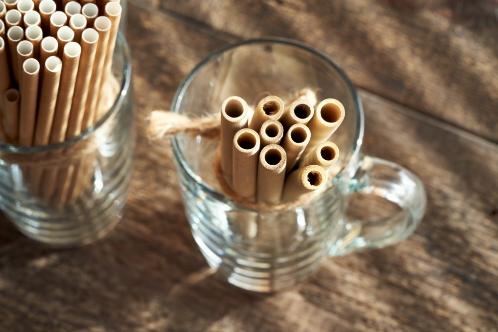 Bamboo and paper straws for drinks - zero waste or ecological lifestyle concept