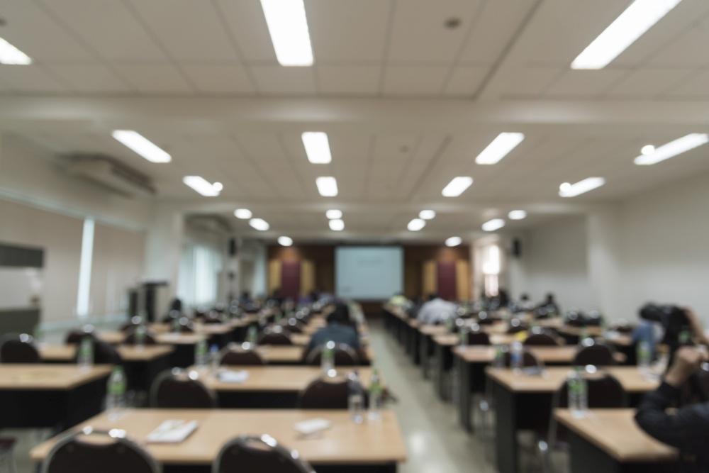 Blurred background of seminar room for audience.