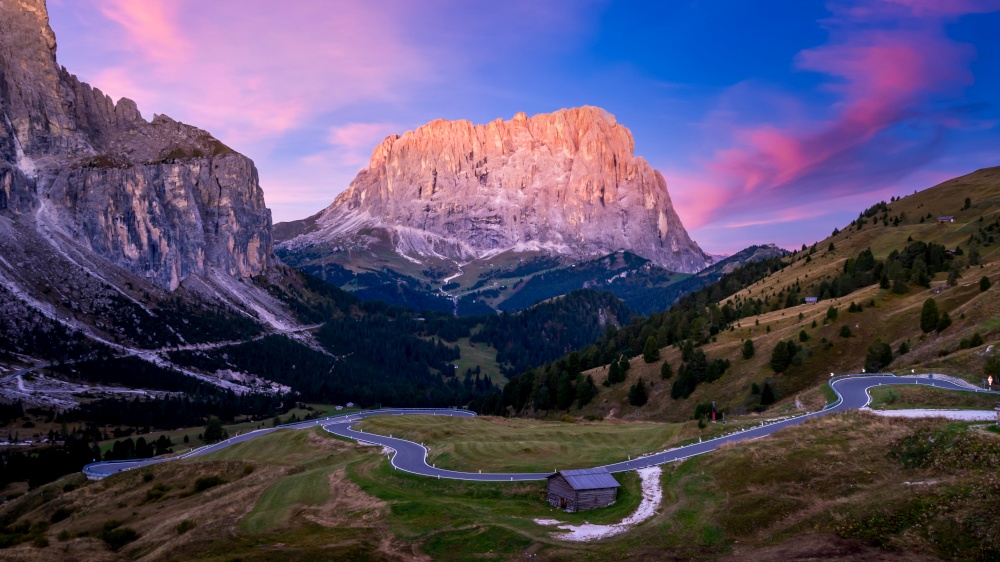 Beautiful mountain road highway road of Passo Gardena in Dolomites, Dolomites landscape with asphalt mountain road, Italy.