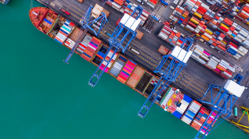 Aerial view container ship in commercial port, Business industry commerce global import export logistic transportation oversea worldwide, Sea shipping company vessel.