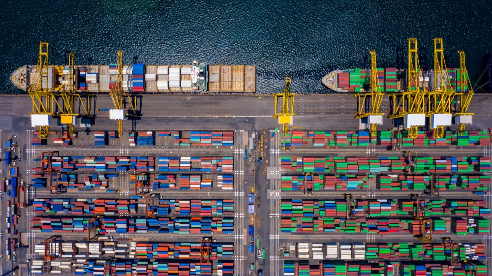 Aerial view container ship in commercial port, Business industry commerce global import export logistic transportation oversea worldwide, Sea shipping company vessel.