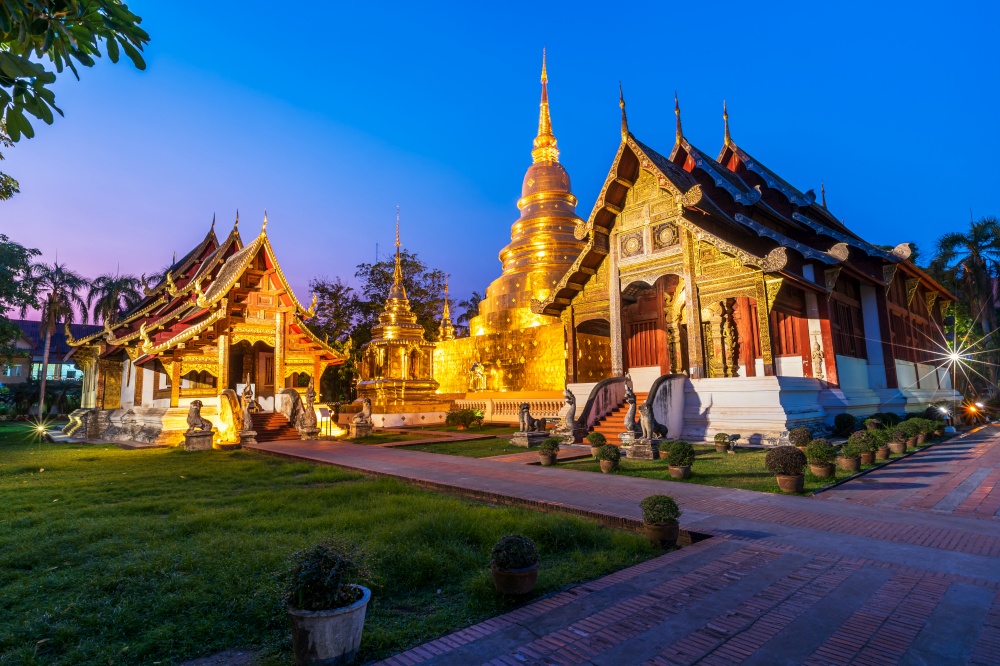 Wat Phra Singh is a Buddhist temple is a major tourist attraction in Chiang Mai Northern Thailand at twilight sunset sky background ,Travels in Southeast Asia,is Public places