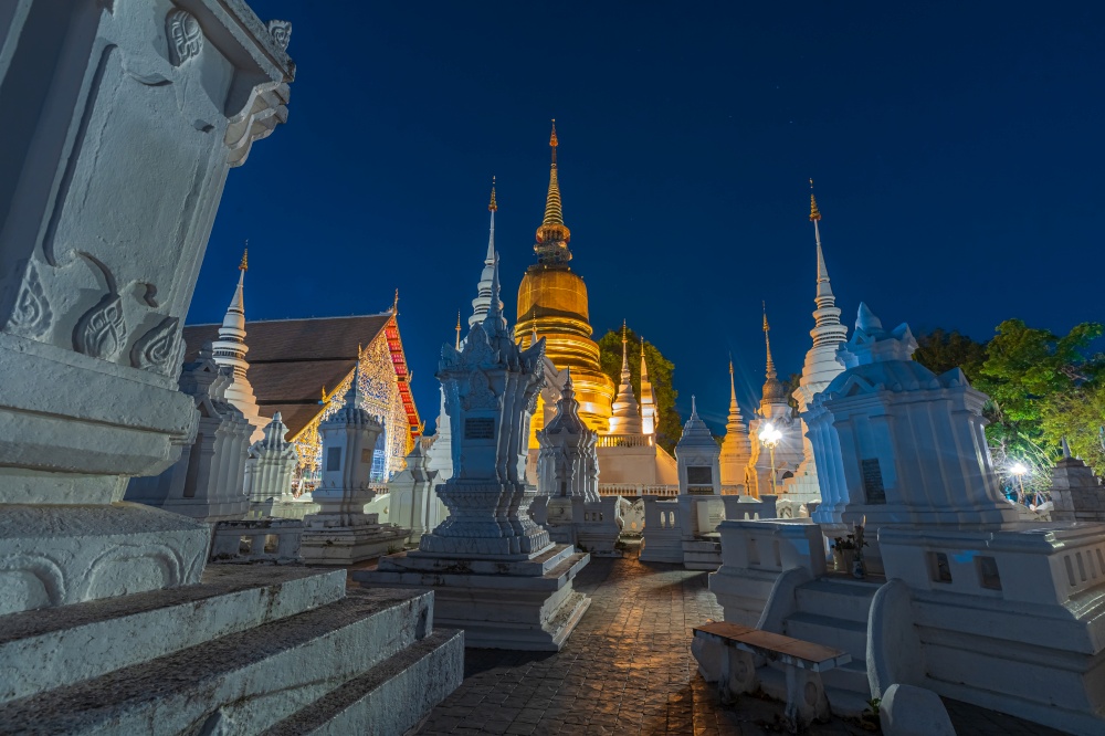 Wat Suan Dok is a Buddhist temple (Wat) at twilight night sky background is a major tourist attraction in Chiang Mai Northern Thailand.Travels in Southeast Asia.