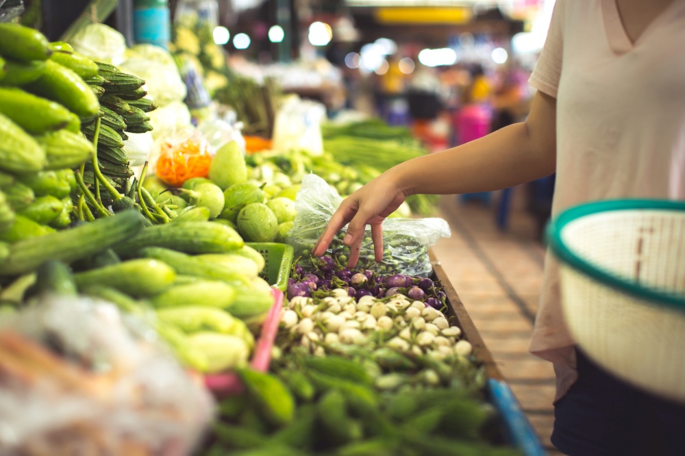 woman shopping organic veggies and fruits