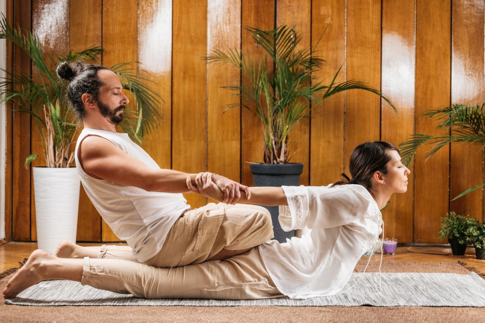 Thai Yoga Massage - Stretching Female Patient in the Cobra Position