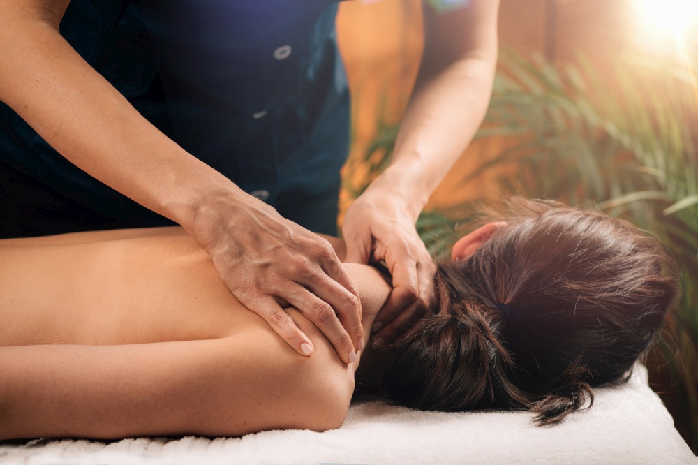 Woman Enjoying Deep Tissue Massage in Salon. Woman Enjoying Deep Tissue Massage