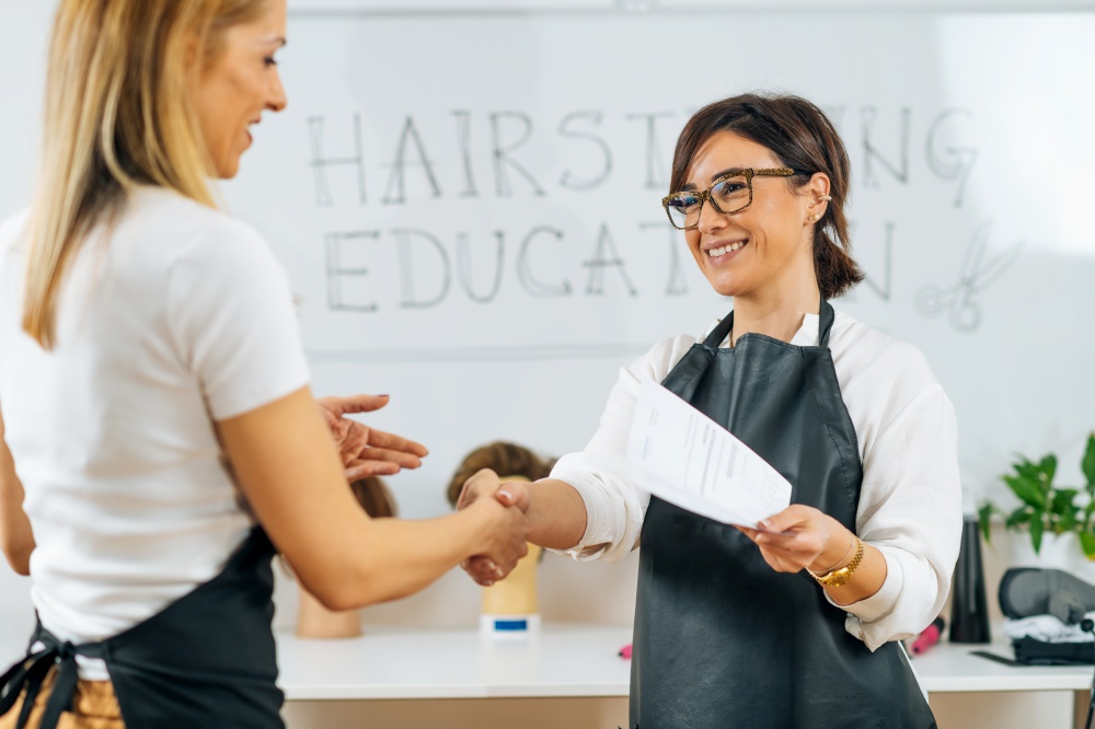 Handshake - Hairstyling Educator and Female Student at the End of Hairstylist Training