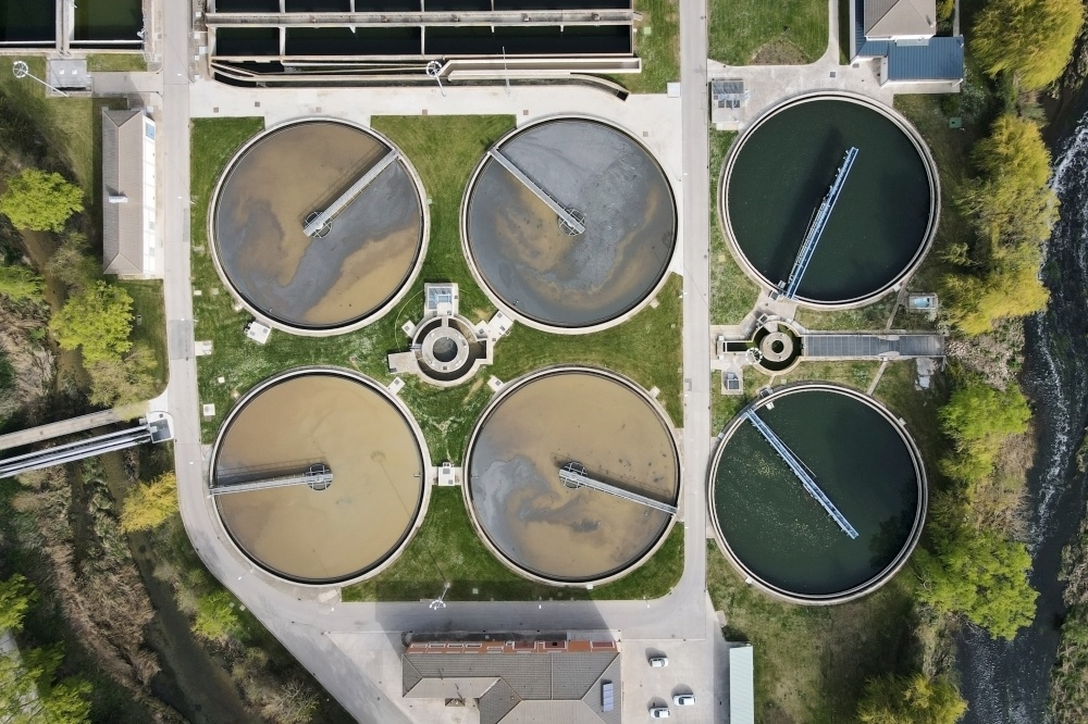 Aerial top view of round polls in wastewater treatment plant, filtration of dirty or sewage water. High quality photo. Aerial top view of round polls in wastewater treatment plant, filtration of dirty or sewage water.