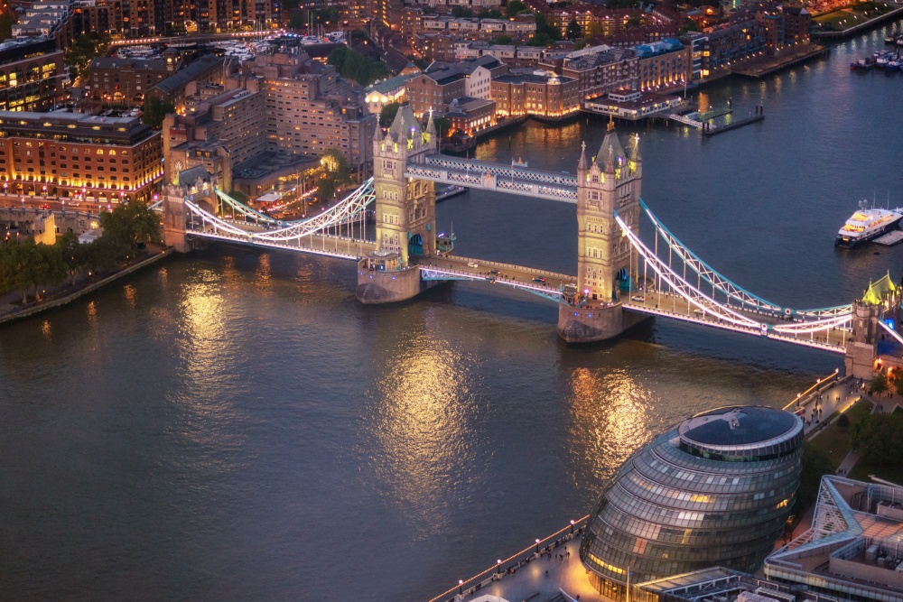 Tower Bridge and River Thames aerial view at magic hour, London, United Kingdom .. Tower Bridge and River Thames aerial view at magic hour, London, United Kingdom.