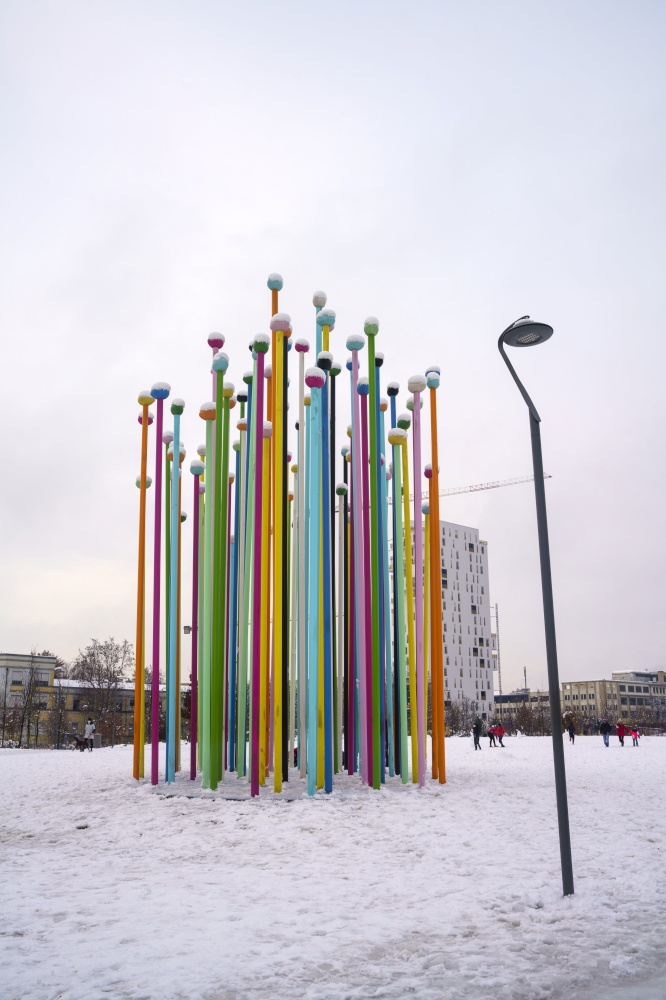 Milan, Italy: the modern Citylife park with snow. Colorful installation