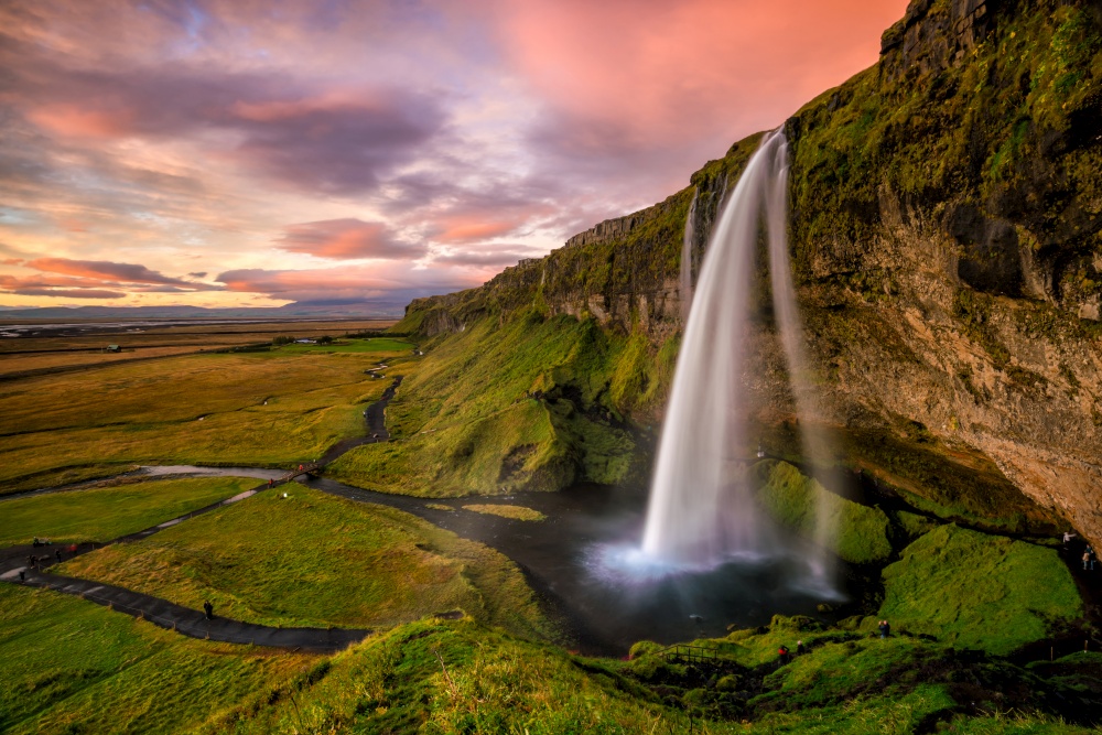 Seljalandsfoss waterfall at sunset in Iceland