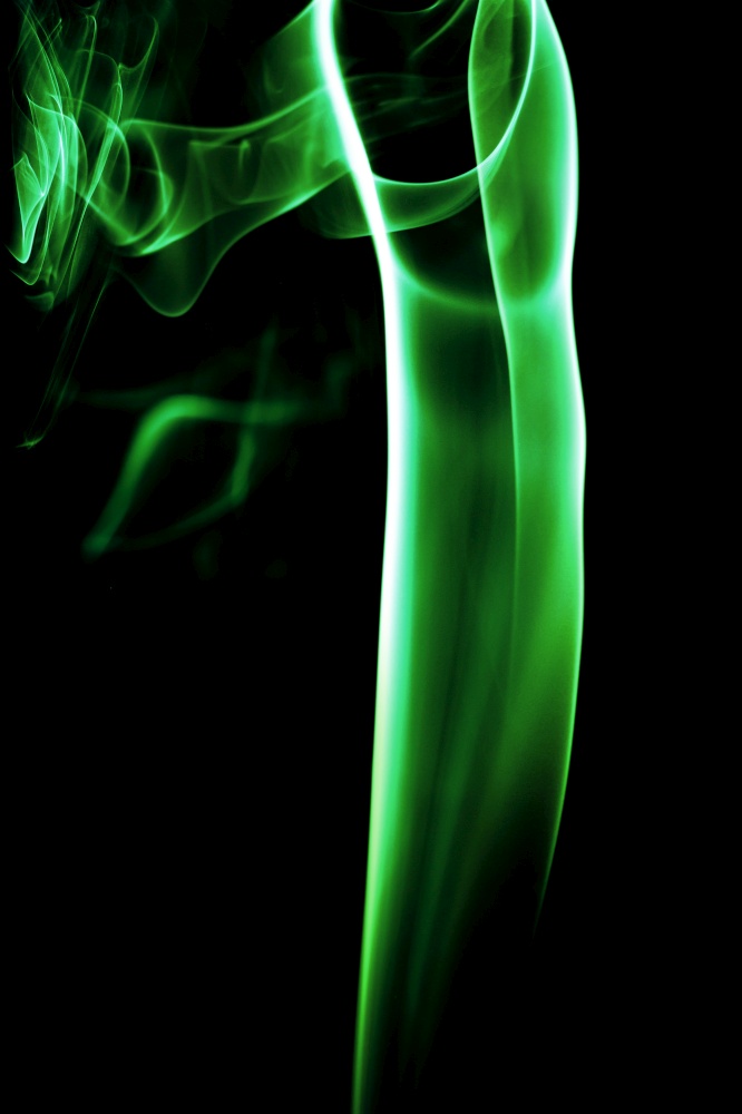 Abstract green smoke on black background