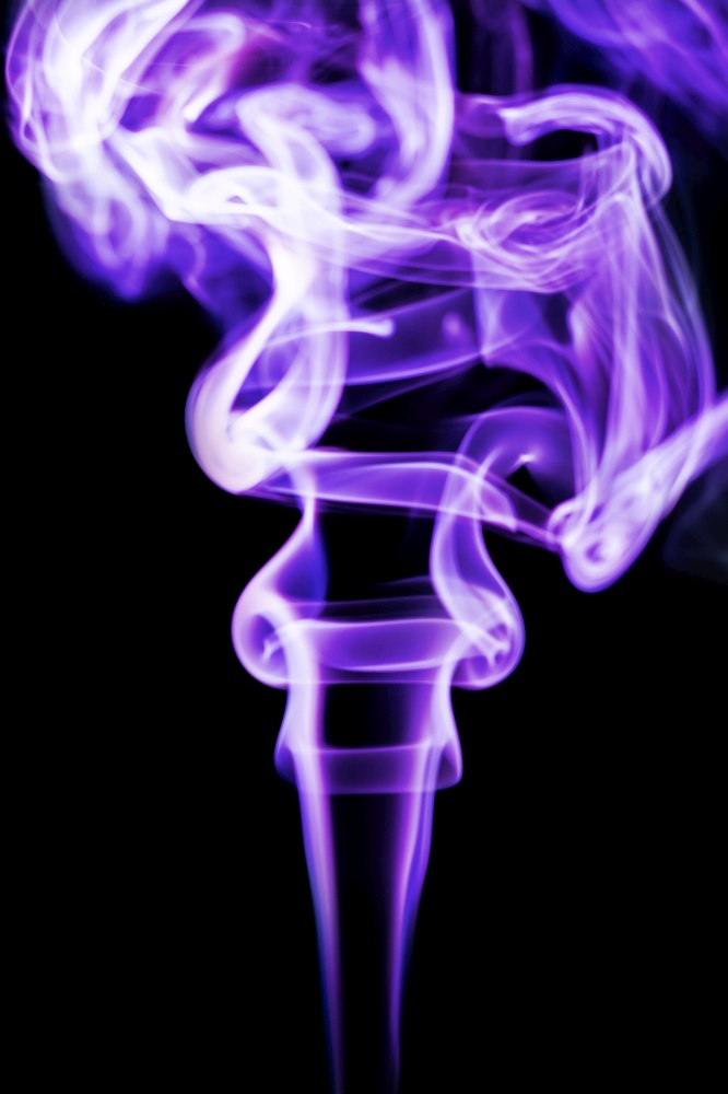 Abstract purple smoke on black background