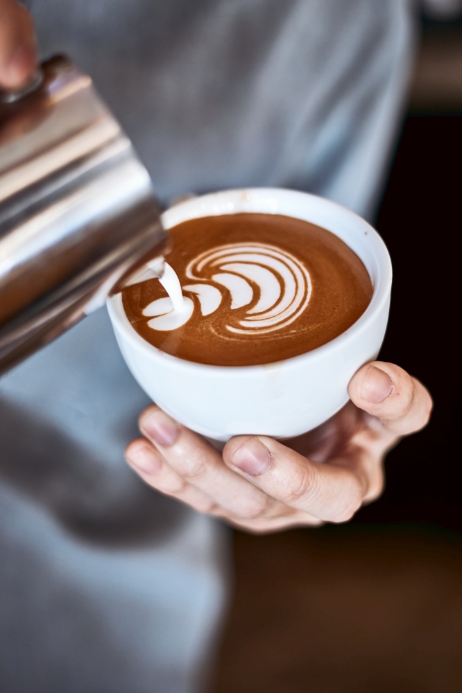 coffee latte art making by barista . coffee latte art