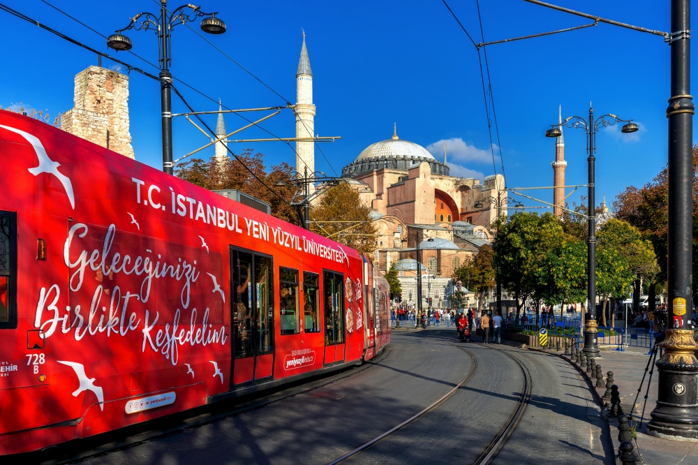 TURKEY, ISTANBUL - 22 Oct, 2019.Red Tram tramway passing at Hagia Sophia in Istanbul, Turkey.