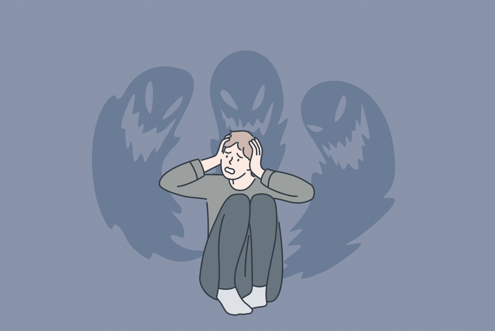 Phobias and inner fears concept. Young stressed man sitting touching head feeling bad with ghosts at wall from inside fears vector illustration . Phobias and inner fears concept