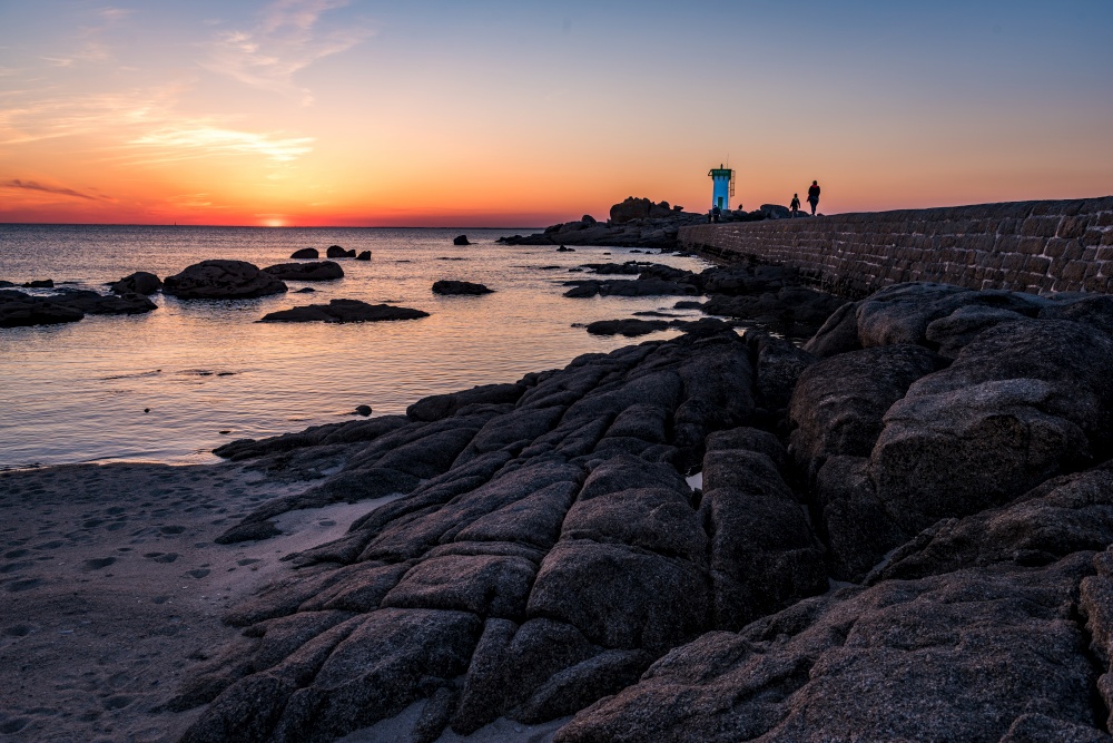 Rocky coast and lighthouse in Trevignonat sunset, Brittany, France. Rocky coast and lighthouse in Trevignonat sunset, Brittany