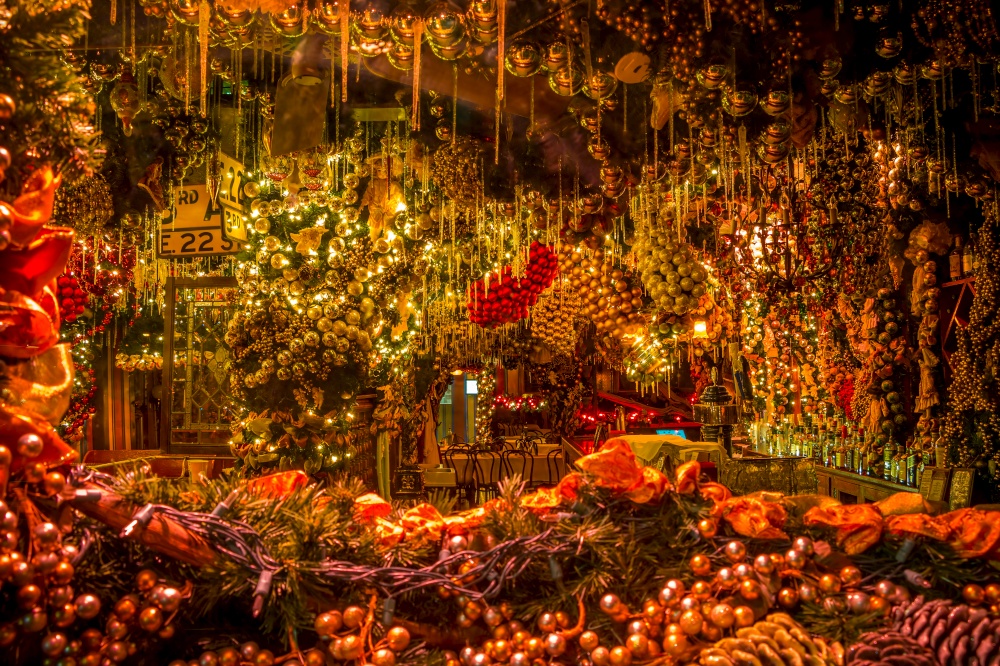Christmas showcase a small cafe in new York. A lot of Christmas balls, garlands and decorations. Christmas Window of the Cafe