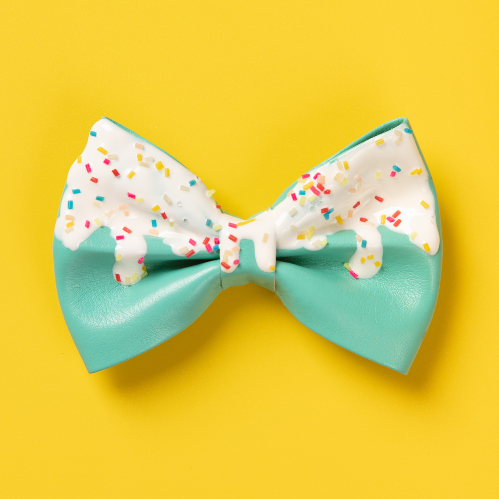 Cute hair bow on bright background, flat lay, top view