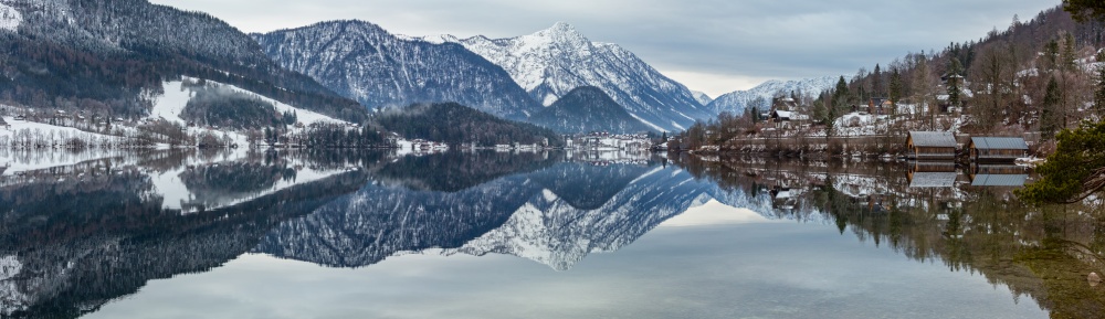 Cloudy winter Alpine  lake Grundlsee view (Austria) with fantastic pattern-reflection on the water surface.