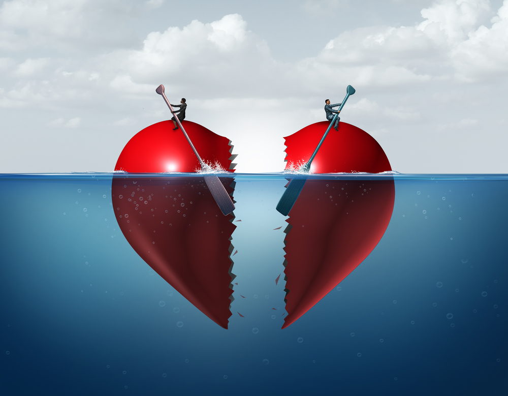 Divorce separation as a broken relationship with a couple drifting away breaking a heart apart showing the concept of a marriage dispute and dividing assets with 3D illustration elements.