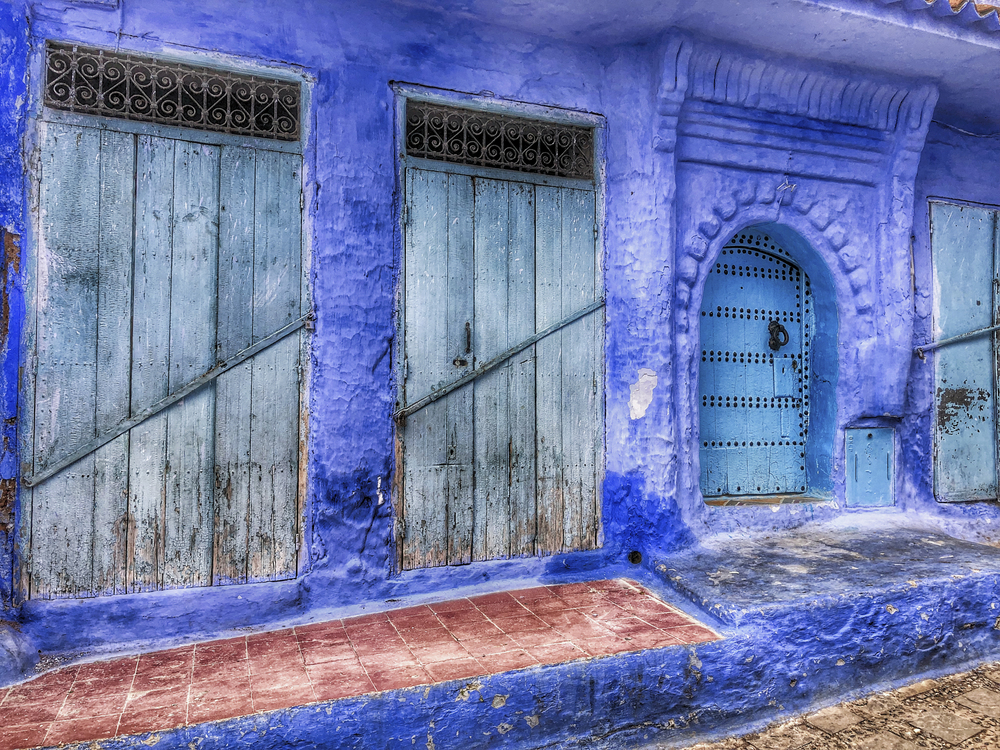 A storefront in Chefchaouen, Morocco that is covered in blue paint.
