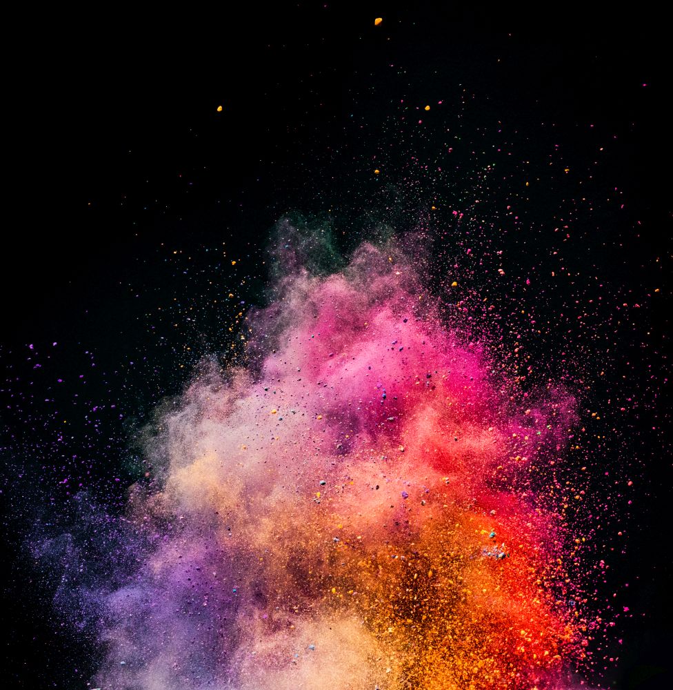 Holi powder exploding on black background. Festival of colors. Copyspace.. Holi powder exploding on black background.