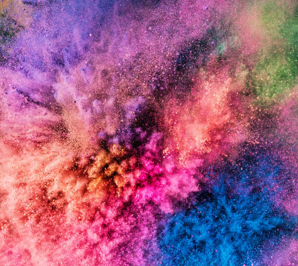 Holi powder bursting up, creating exploding texture. Festival of colors. Vivid background.. Holi powder bursting up, creating exploding texture.
