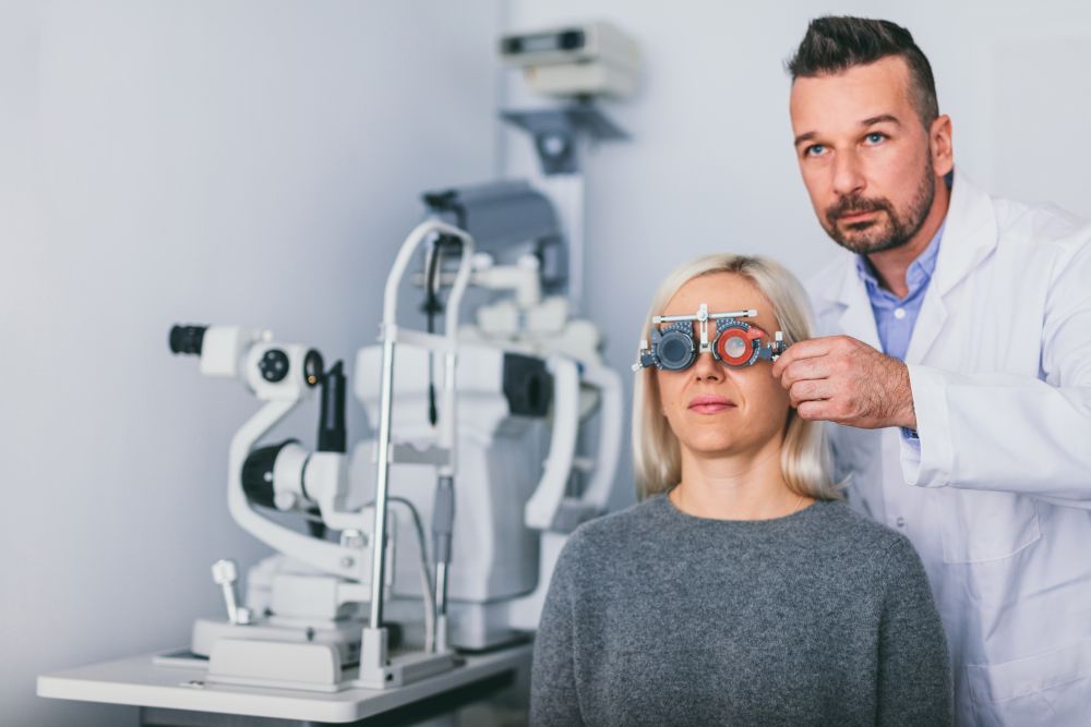 Optician examining woman&rsquo;s eyes. Eyesight diagnostics, medical examination.. Optician examining woman&rsquo;s eyes.