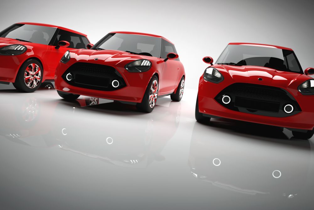 Fleet of red small city cars on light background. Brandless vehicle, transportation. 3D illustration.. Fleet of red small city cars on light background.