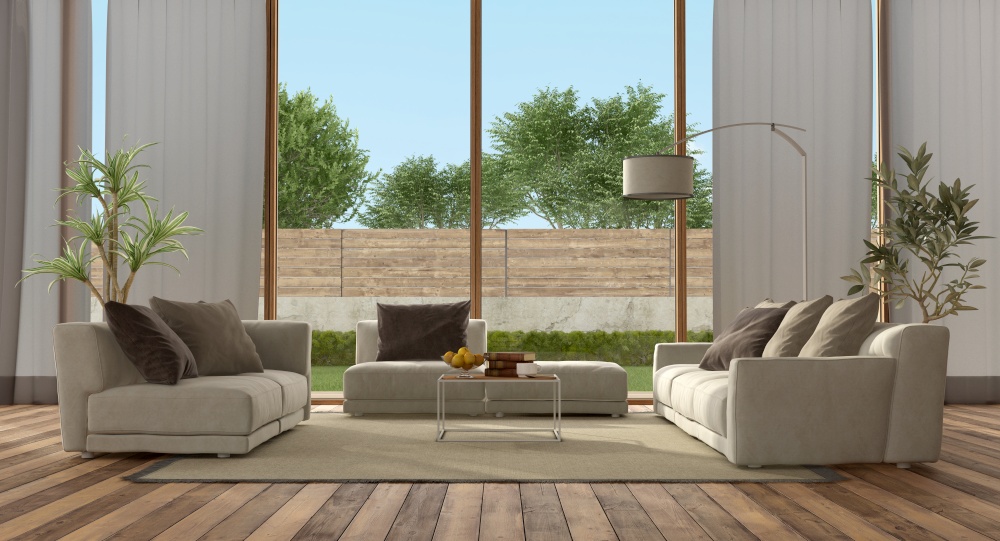 Living room of a modern villa with garden on background - 3d rendering. Living room of a modern villa