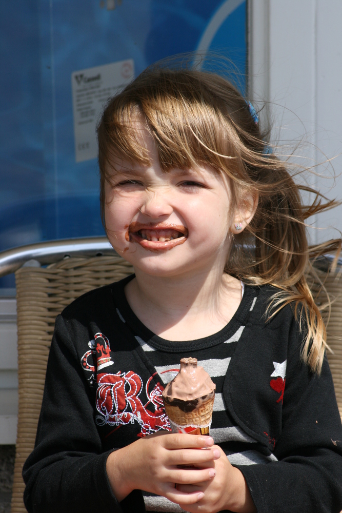 a blond girl with ice cream