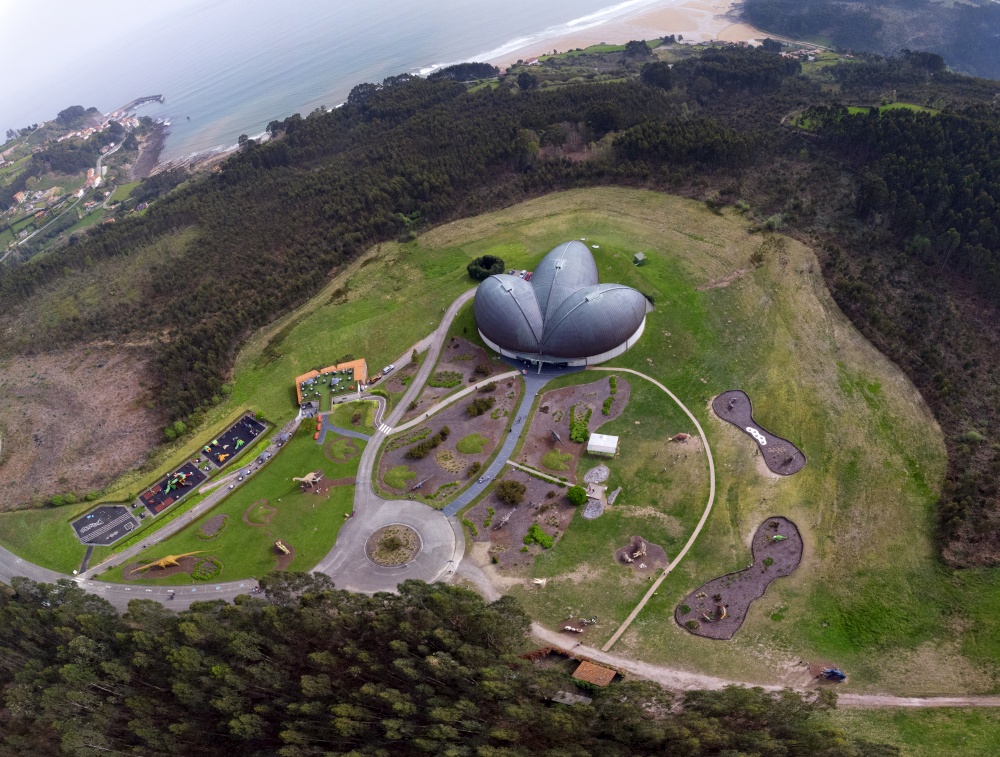 Aerial view of the Jurassic Museum in the shape of a dinosaur footprint in Colunga, Asturias. Spain