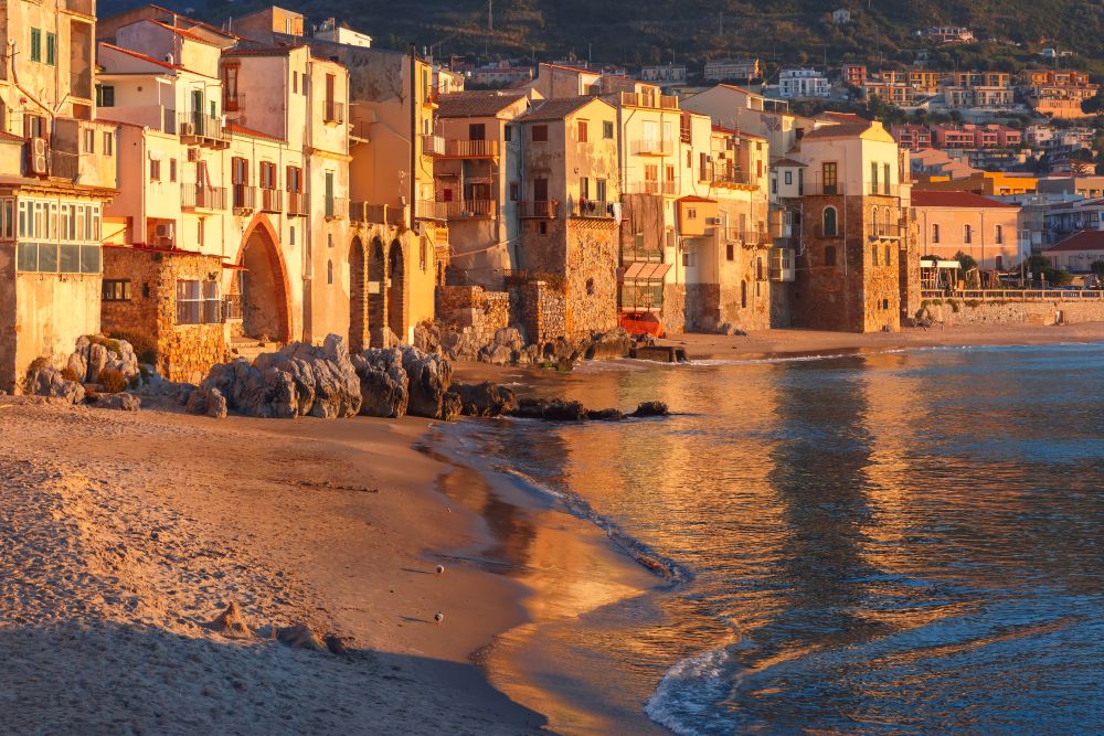 Beautiful view of old houses in coastal city Cefalu at sunset, Sicily, Italy. Cefalu at sunset, Sicily, Italy