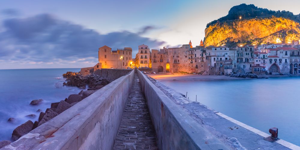 Beautiful panoramic view of coastal city Cefalu at sunrise, Sicily, Italy. Cefalu at sunrise, Sicily, Italy