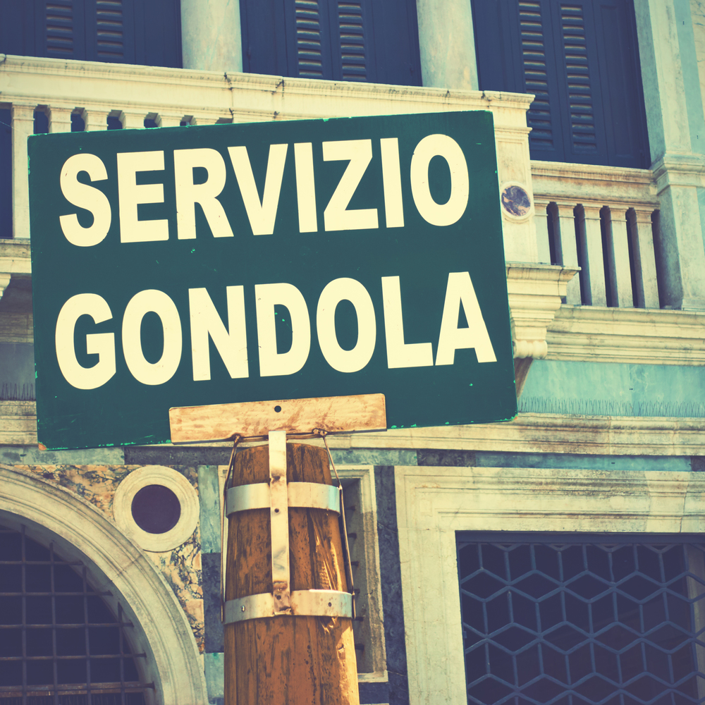 Gondola service sign on a pole in Venice, Italy/ Vintage style image