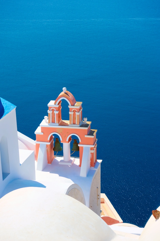 Santorini island in Greece. Aegean sea anf typical greek church with belfry