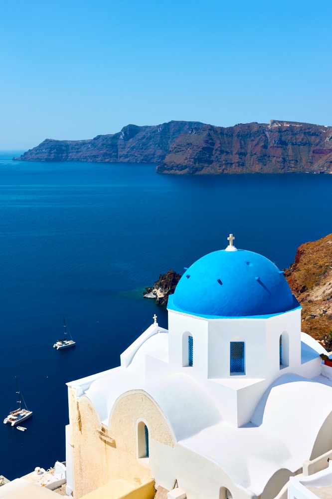 Greece, Santorini Island. Scenic view with white church on the coast on the high coast by the sea. Greek landscape