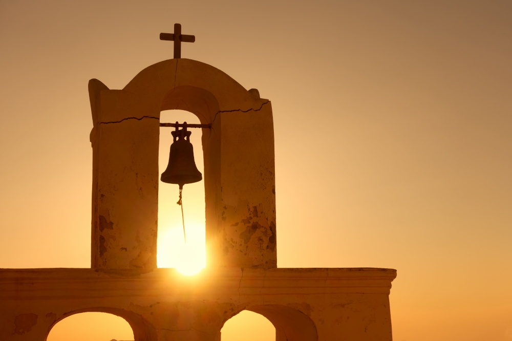 Bell tower in Santorini at sunset, Greece