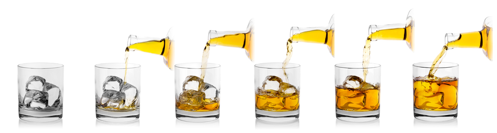 Process of pouring whiskey from bottle into glass with ice. Isolated on white background. Collage.. Process of pouring whiskey from bottle into glass with ice