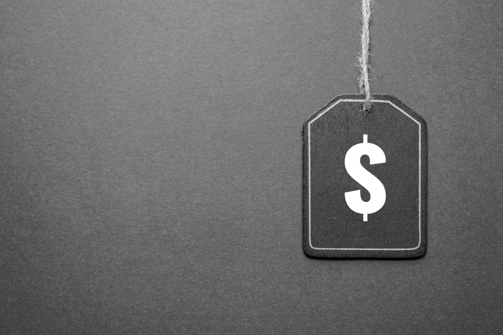 black price tag with dollar sign on the black background, black mockup
