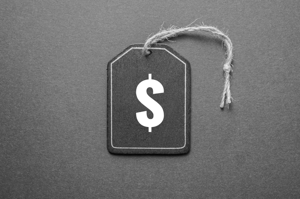 black price tag with dollar sign on the black background, black mockup