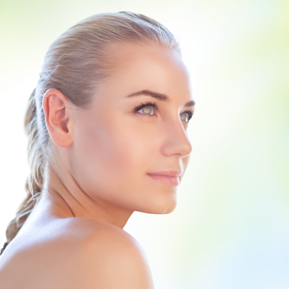 Closeup portrait of a nice blond woman over clear background, conceptual photo of natural beauty, skin care, pampering, day spa