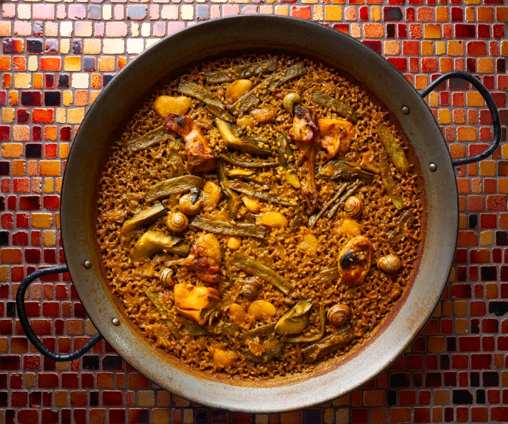 Valencian Paella with chicken rabbit artichokes beans and snails