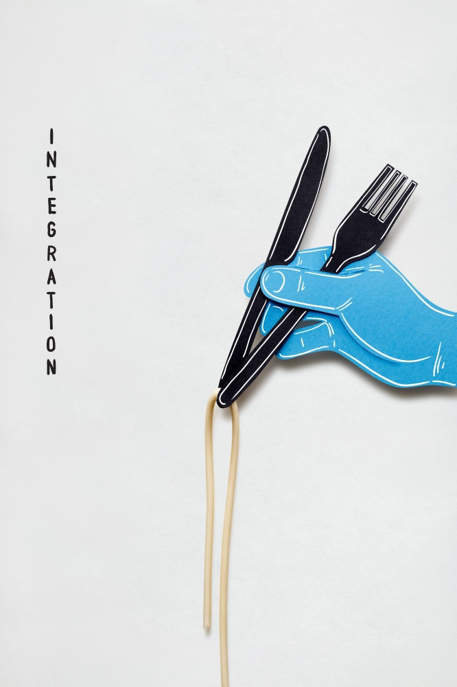 Creative concept photo of a hand with fork knife and pasta made of paper on white background.