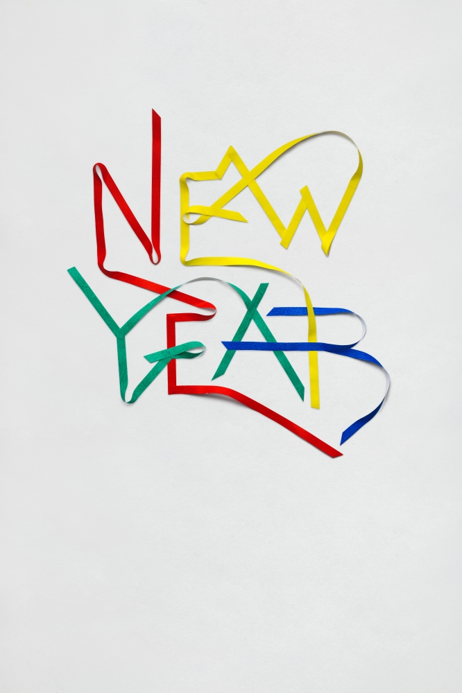 Creative photo of new year sign made of paper on white background.
