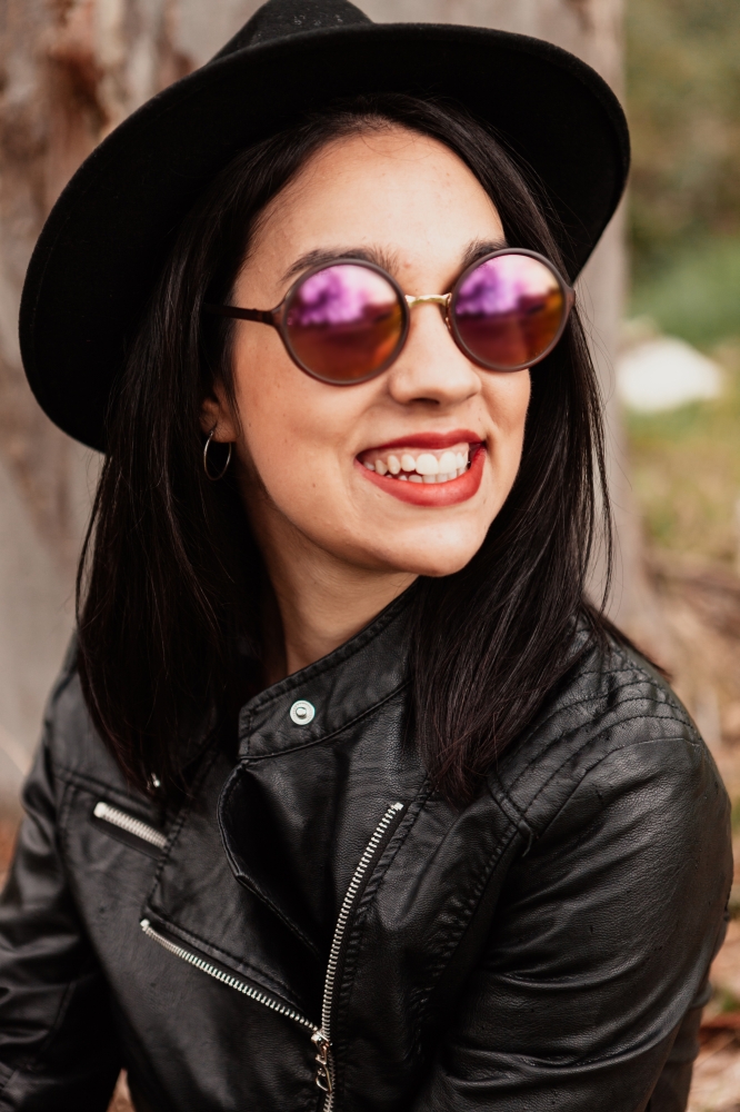 Pretty brunette girl with leather jacket and red lips
